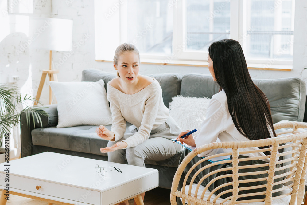 psychological consultation young Asian specialist psychologist or coach conducts a session for a patient of a young woman, problem solving, mental health psychological consultation young Asian specialist psychologist or coach conducts a session for a patient of a young woman, problem solving, mental health