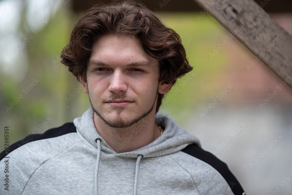 Portrait of young man with hood outdoor