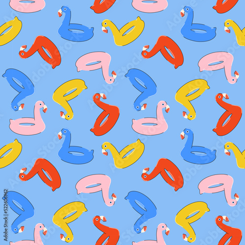 Seamless summer pattern with colorful inflatable rubber flamingos in bright blue, rred, pink, yellow colors in flat style. For print, package, wrapper, background.