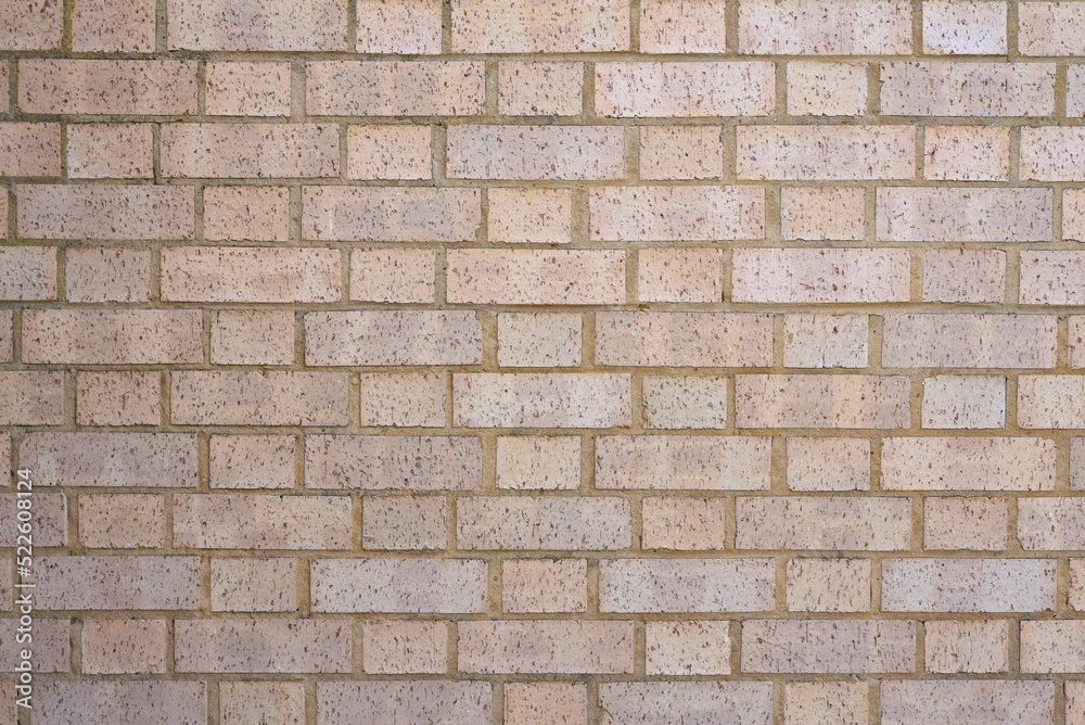 Light pink, purple color brick wall background.