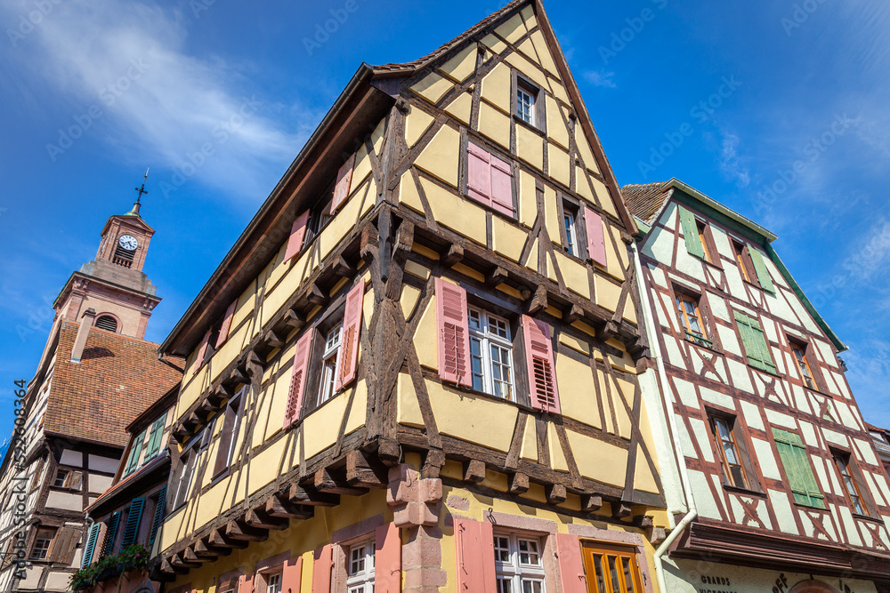 Riquewihr alsatian architecture at springtime with flowers, Eastern France