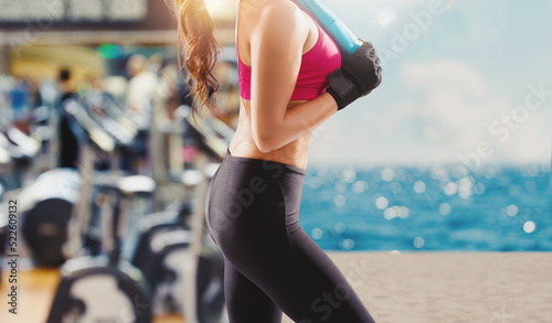 Bild auf Leinwand Woman at the gym ready to the summer vacation