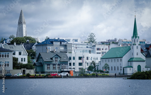 Scenic Cloudy Cityscape with Churches and Hallgrimskirkja in Reykjavik Iceland 