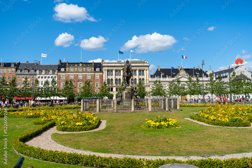Obraz premium The King's New Square (Kongens Nytorv) with Equestrian statue of Christian V . D'Angleterre Hotel. One of Denmark's most exclusive hotels with a history back to 1755. 15 July 2022 Copenhagen - Denmark