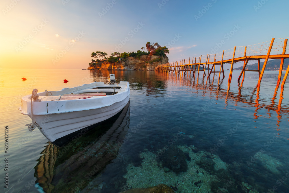 Wooden bridge to Cameo island between Agios Sostis and Laganas village on the amazing turquoise Ionian Sea at morning sunrise on Zakynthos island