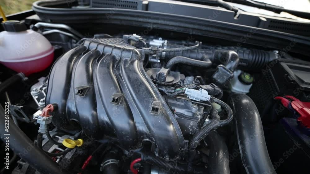 A simple car engine 1.6. Gasoline internal combustion engine. Panning the camera from left to right. A simple car engine 1.6. Gasoline internal combustion engine. Panning the camera from left to right.