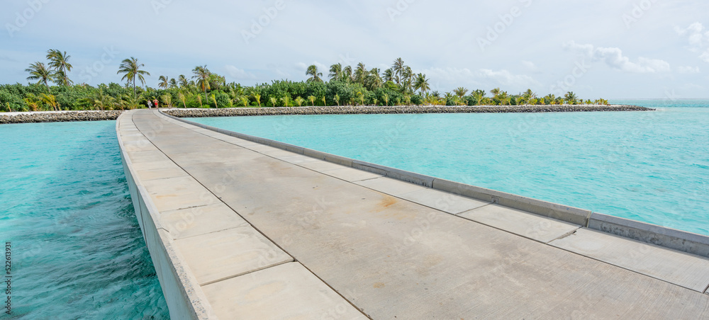 Maldives resort bridge in tropical, exotic paradise with turquoise water