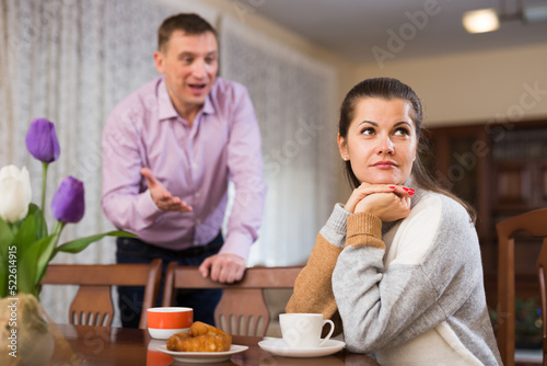 Upset man and frustrated woman arguing at home. High quality photo