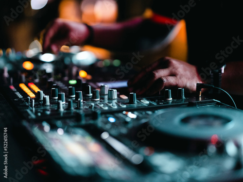 a dj playing music in a nightclub © enginakyurt