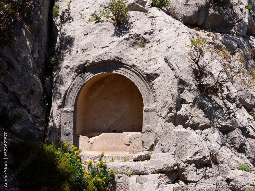Ancient stone tombs carved into the rocks of the city of Termessos, currently located near Antalya, Turkey