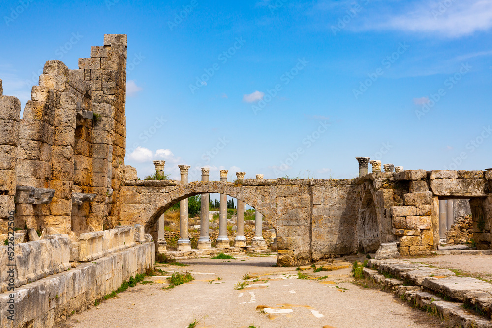 Streets of the ancient city of Perge with marble columns and antique statues, Turkey