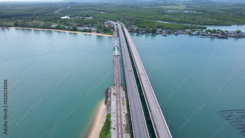 Aerial view drone shot of Amazing bridge with cars on bridge road. Transportation and travel background. Located at Sarasin bridge in Phuket Thailand Aerial view drone shot of Amazing bridge with cars on bridge road. Transportation and travel background. Located at Sarasin bridge in Phuket Thailand