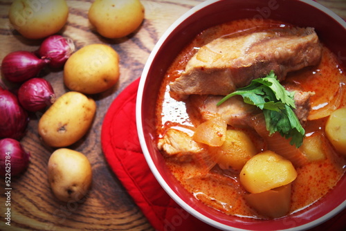 Hot traditional Thai beef massaman curry, thai cuisine, horizontal view from above