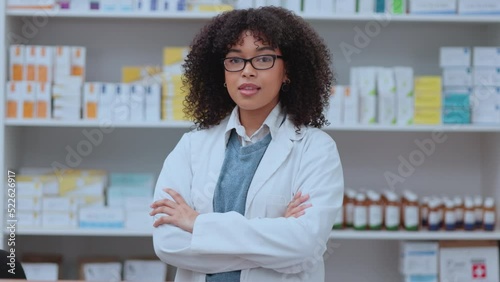 Portrait of proud intern with folded arms working in a modern pharmacy or drug store, confident and ready. Black woman satisfied with her new job in health care, competent and accomplished career photo