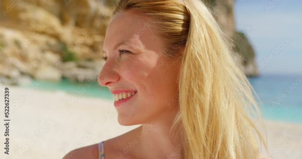Closeup of happy, attractive young woman smiling and enjoying holiday beach getaway while wearing sunglasses. Portrait of caucasian female laughing and relaxing on fun summer vacation trip at seaside Closeup of happy, attractive young woman smiling and enjoying holiday beach getaway while wearing sunglasses. Portrait of caucasian female laughing and relaxing on fun summer vacation trip at seaside
