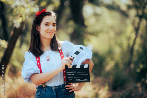 Tableau sur toile Happy Actress Holding a Cinema Clapper in the Forest