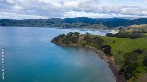 Aerial View of Waitawa Regional Park, Beach, Pier, Deck Green Trees and Cliff in New Zealand - Auckland Area © Rodrigo
