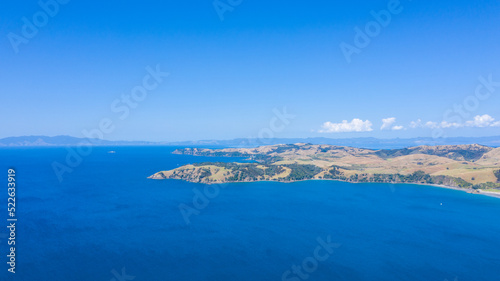  Aerial View from Ocean, Beach, Green Trees and Mountains in Waiheke Island, New Zealand - Auckland Area © Rodrigo