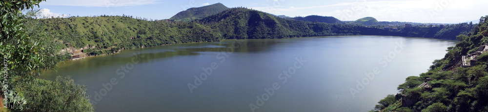 Panoramic view encompassing the forested and hilly shores of Lake Bishoftu, a crater lake in central Ethiopia south of Addis Ababa