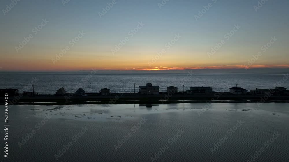 Sunset drone shot of waterfront houses on Whidbey Island. Sunset drone shot of waterfront houses on Whidbey Island.