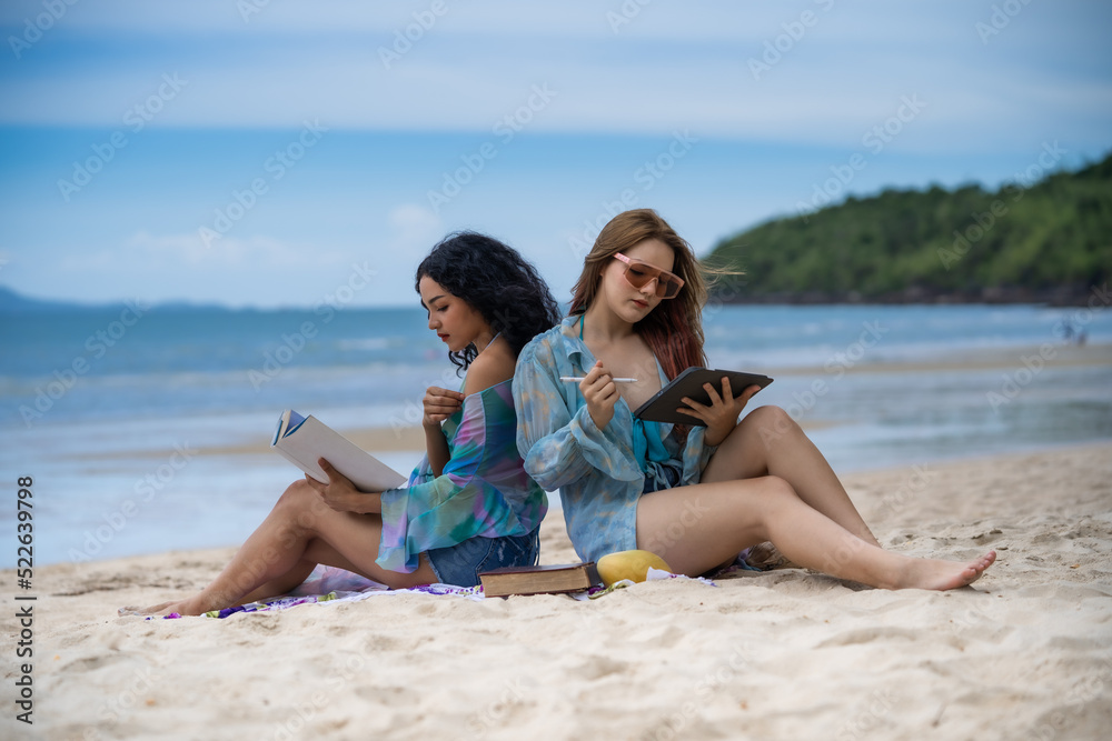 Two Women LGBT Relationship summer holiday on the  beach.