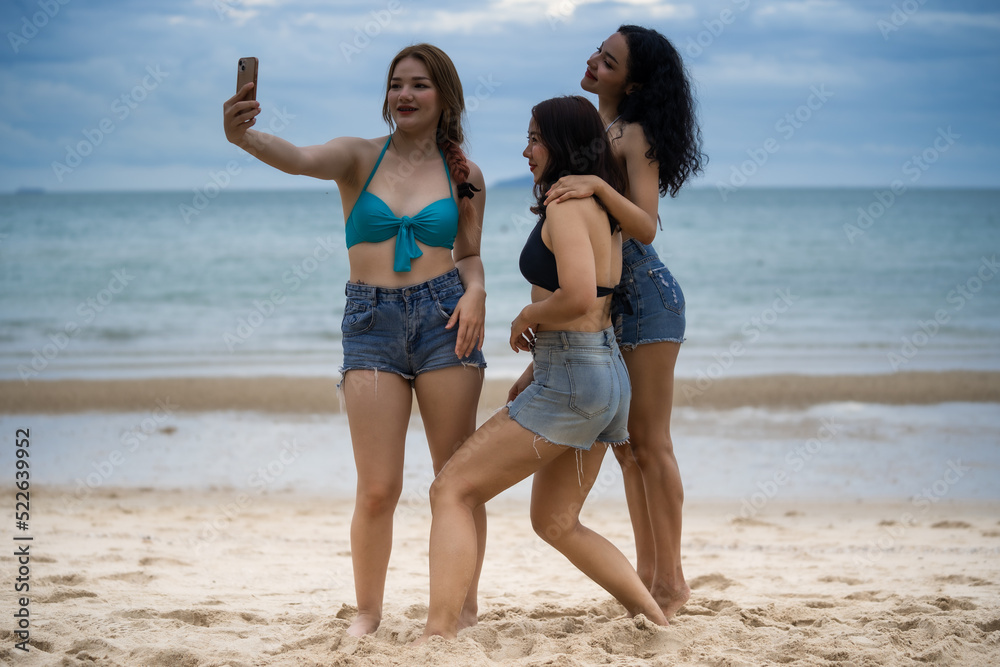 Three Women LGBT Relationship summer holiday on the beach. Three Women LGBT Relationship summer holiday on the beach.