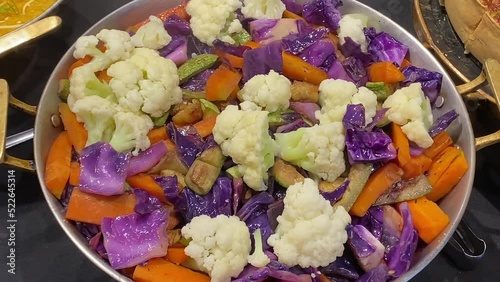 Mix of hot vegetables emitting smoke (visible vapor)