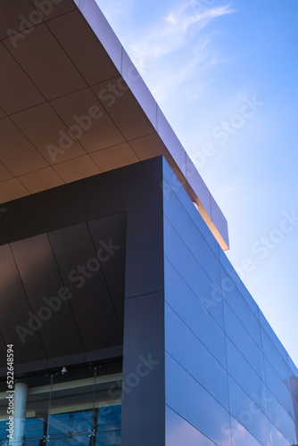 Gray building with sky in the background.