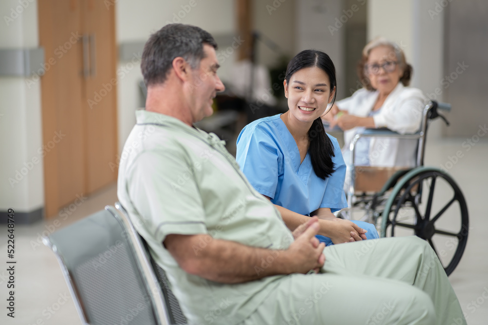 At hospital walkway doctor meet nurse and patient on wheelchair doctor