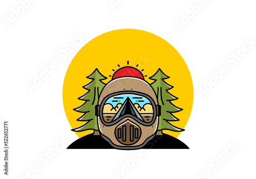 a trail helmet with a pine tree beside