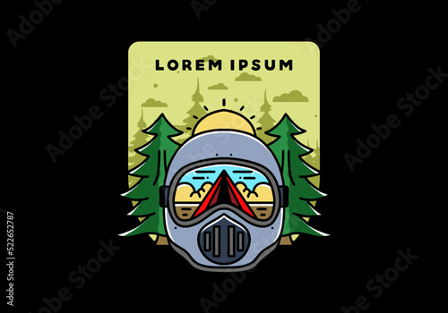 a trail helmet with a pine tree beside