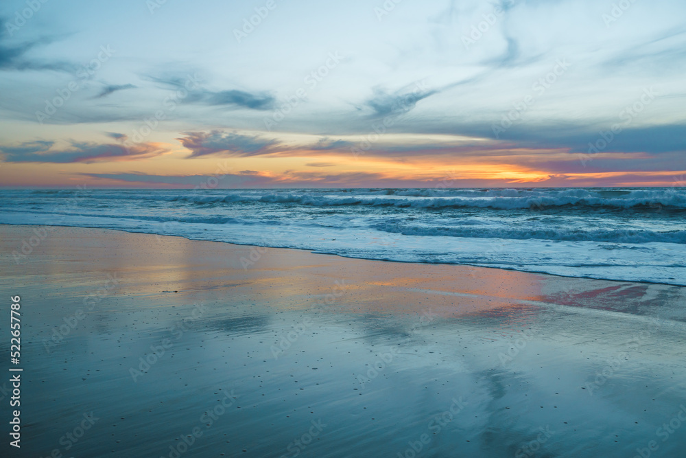Scenic seascape, sunset over the ocean. Tranquil scene, beautiful sun reflection and stormy ocean Scenic seascape, sunset over the ocean. Tranquil scene, beautiful sun reflection and stormy ocean
