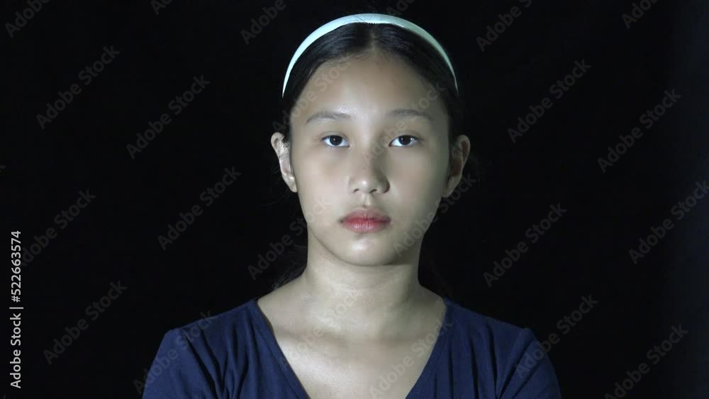 A Serious Asian Teen Girl Isolated A Serious Asian Teen Girl Isolated