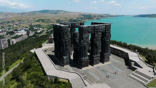 Chronicle of Georgia Monument Located Near The Tbilisi Sea In Georgia - aerial drone shot photo