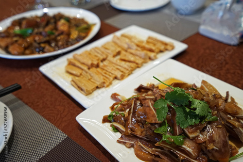 Close up stir fry crispy pig ears with deep fried soy tofu- Yunnan Chinese food