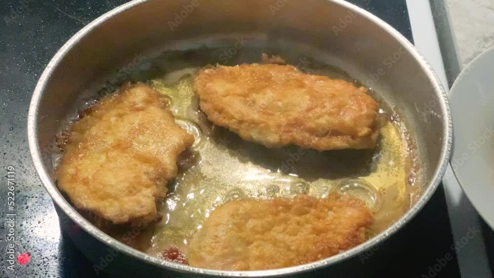 Slow motion of frying steaks in the hot oil. Slow motion of frying steaks in the hot oil.