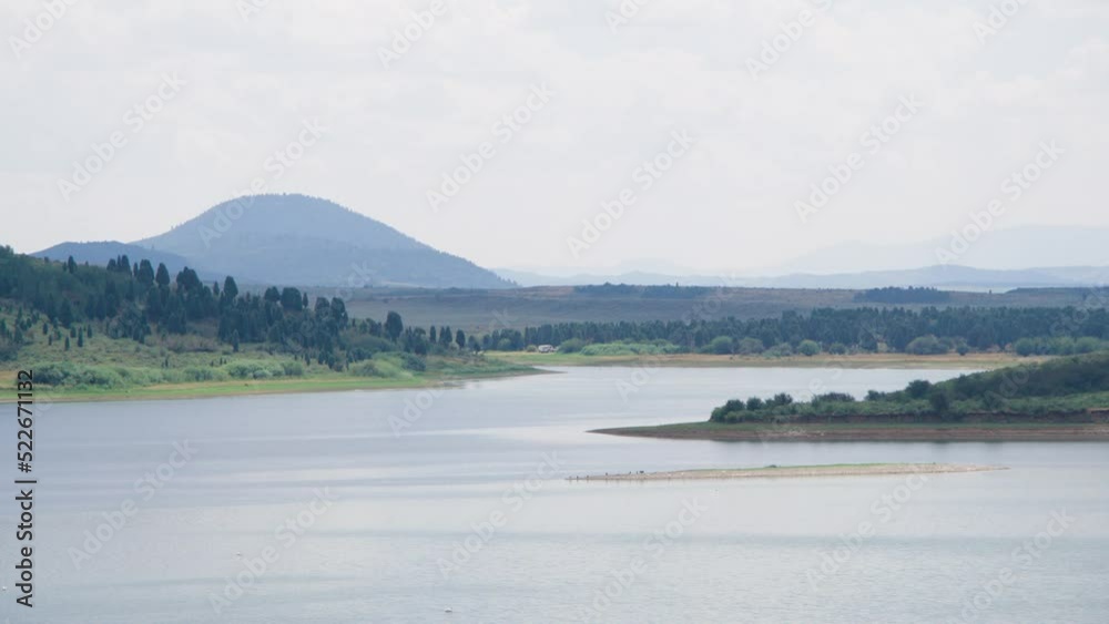 A natural water inlet along the Blackfoot Reservoir in Caribou County, Idaho. A camper found a spot along the lake on a hot summer day. A natural water inlet along the Blackfoot Reservoir in Caribou County, Idaho. A camper found a spot along the lake on a hot summer day.
