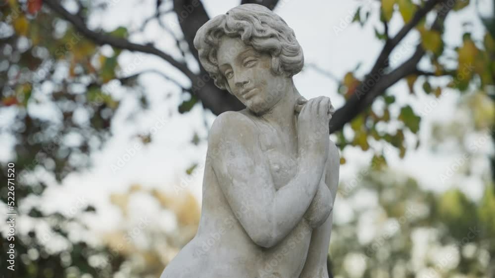 Timeless statue of a woman in the garden Timeless statue of a woman in the garden