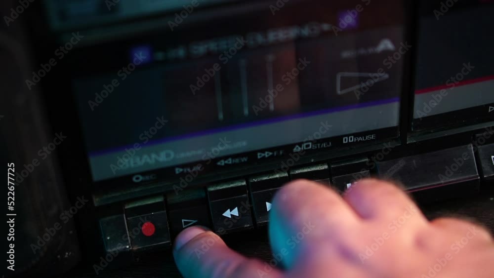 Stockvideo Inserting Audio Cassette Tape in Vintage Boombox Player and