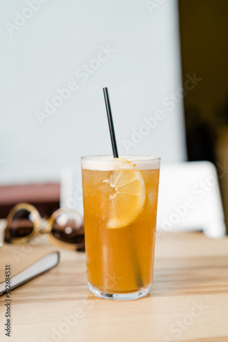 Iced summer orange lemonade with straw