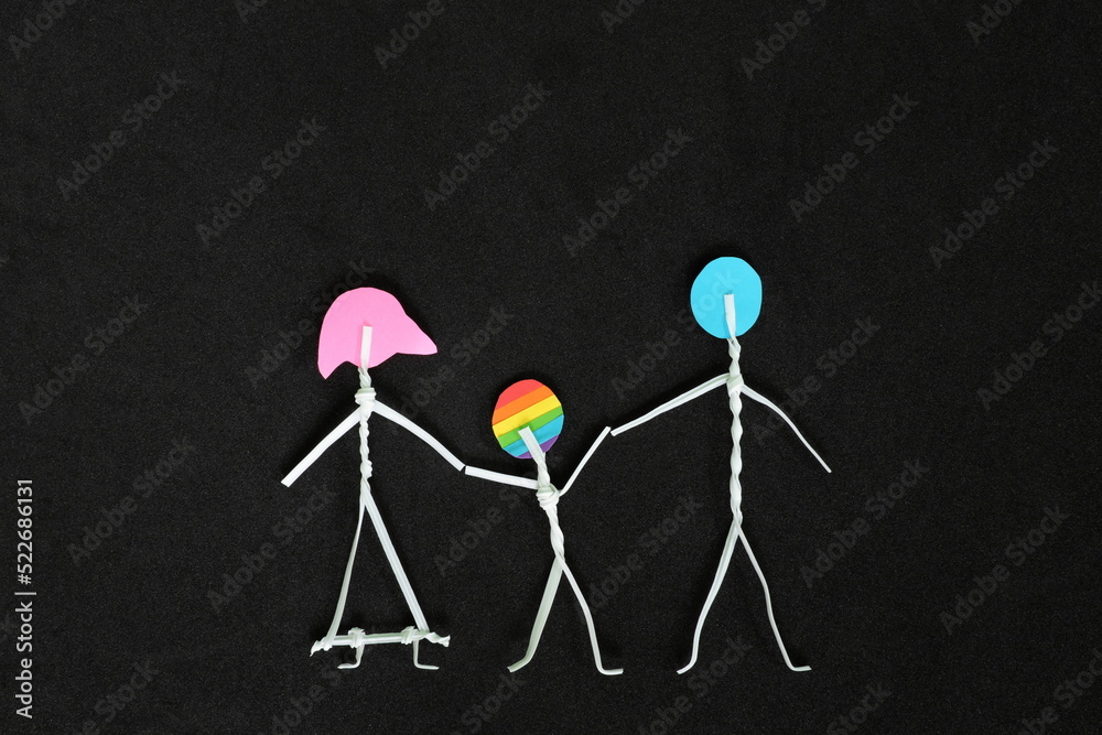 LGBT or LGBTQIA child support and acceptance concept. Family stick figure with gay son in dark black background.