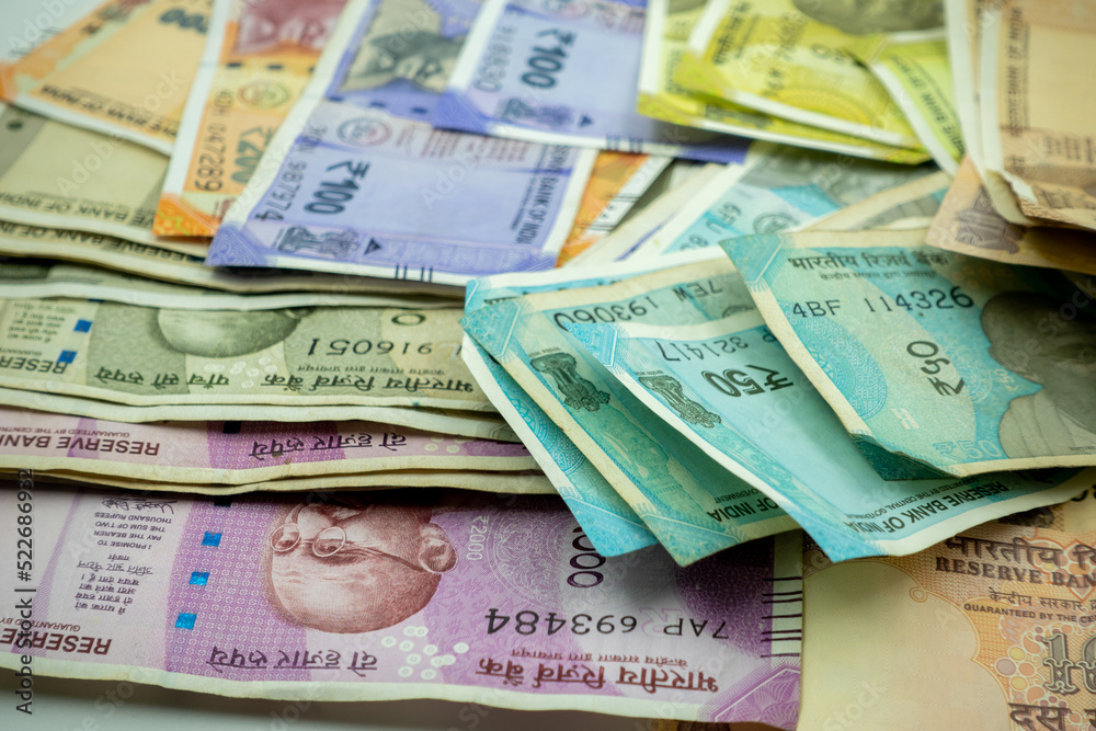 Shot of multiple denominations of Indian rupees. Close up Indian Money. New Indian  currency notes. 10, 20, 50, 100, 200, 500, 200 Indian Rupee notes. paying  in cash. Stock Photo | Adobe Stock