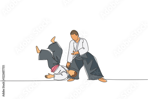 Single continuous line drawing of two young sportive men wearing kimono practice throwing in aikido fighting technique. Japanese martial art concept. Trendy one line draw design vector illustration