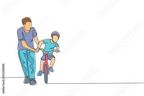 One single line drawing of young father teaching his boy kid riding bicycle at public park graphic vector illustration. Fatherhood lesson. Urban family time concept. Modern continuous line draw design