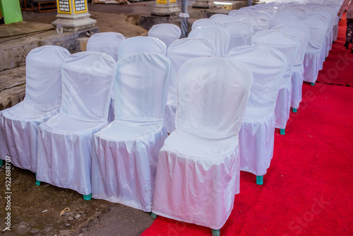 Chairs lined with white cloth covers