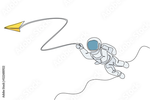 One single line drawing space man astronaut exploring cosmic galaxy, playing with paper plane graphic vector illustration. Fantasy outer space life fiction concept. Modern continuous line draw design