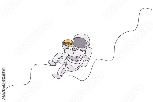 One single line drawing of astronaut flying in cosmos galaxy while eating spicy delicious burger vector graphic illustration. Fantasy outer space life concept. Modern continuous line draw design