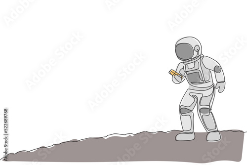 One single line drawing of cosmonaut in moon surface make a call to family in earth with smartphone vector illustration. Astronaut business office with outerspace concept. Continuous line draw design