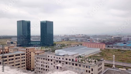 Drone Shots of Yiwu. City view, buildings, and factories on a cloudy day in Yiwu, China photo