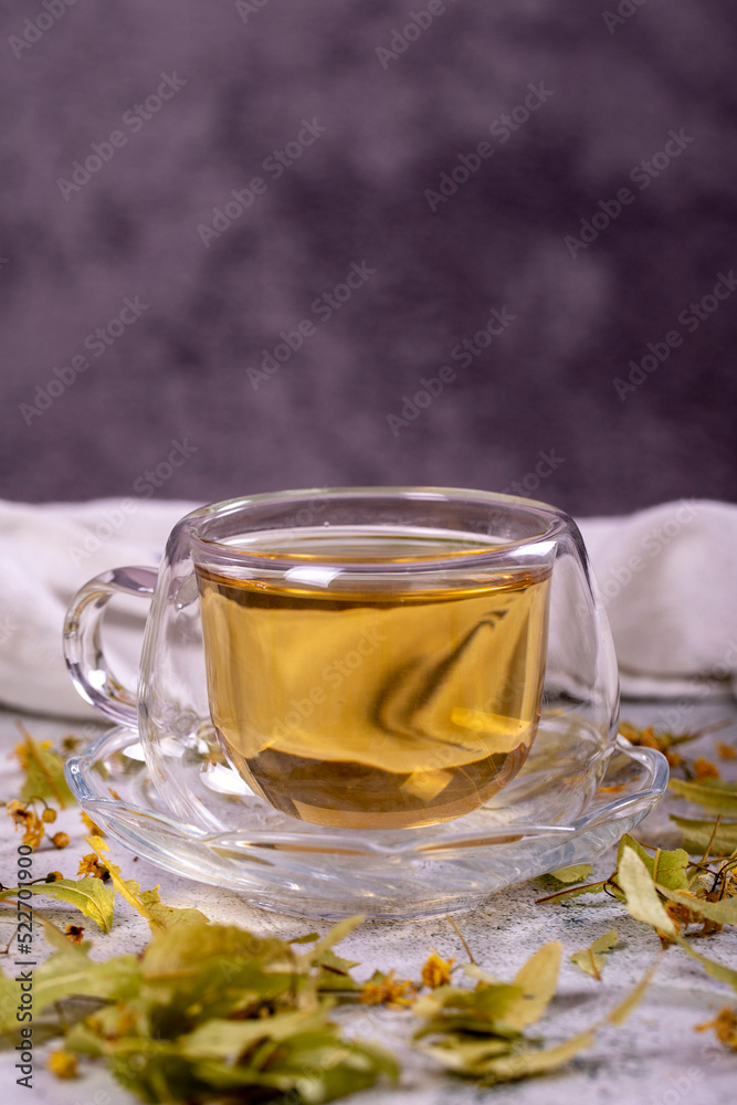 Linden tea. Linden tea on stone background. Herbal tea concept. Healthy drinks. close up Linden tea. Linden tea on stone background. Herbal tea concept. Healthy drinks. close up